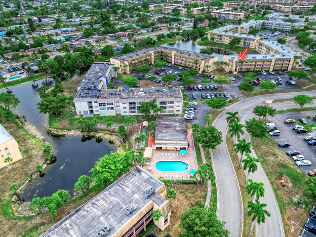 birds eye view of property featuring a water view