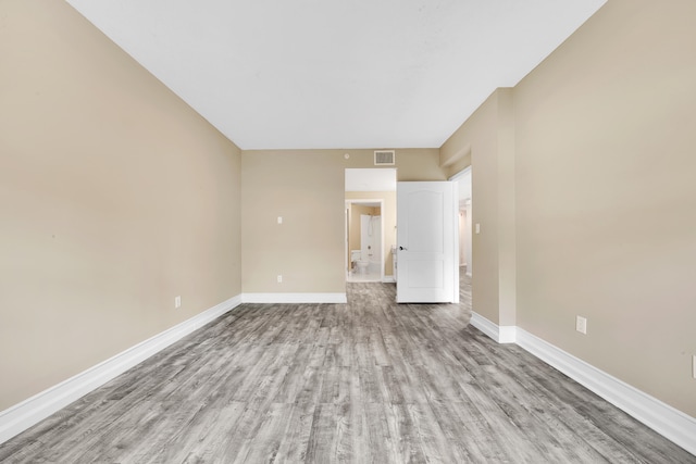 spare room featuring hardwood / wood-style floors