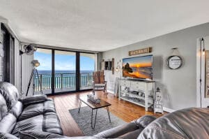 living room featuring hardwood / wood-style floors and floor to ceiling windows