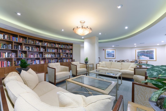 living room featuring a tray ceiling