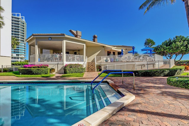 view of swimming pool featuring a patio