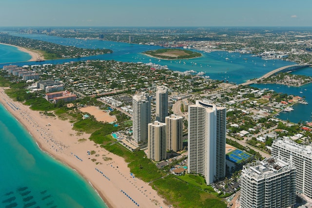 aerial view with a water view and a beach view