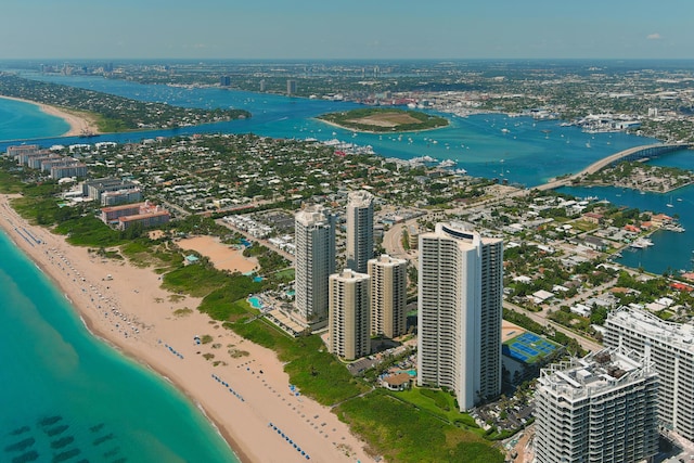 drone / aerial view with a water view and a beach view