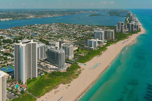 birds eye view of property featuring a water view and a view of the beach