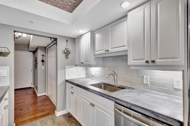 kitchen featuring white cabinets, light wood-type flooring, and sink