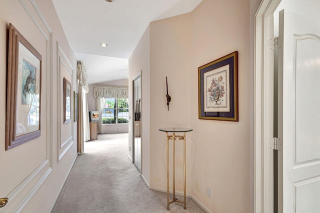 hallway featuring light carpet