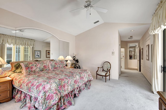 carpeted bedroom with ceiling fan and lofted ceiling