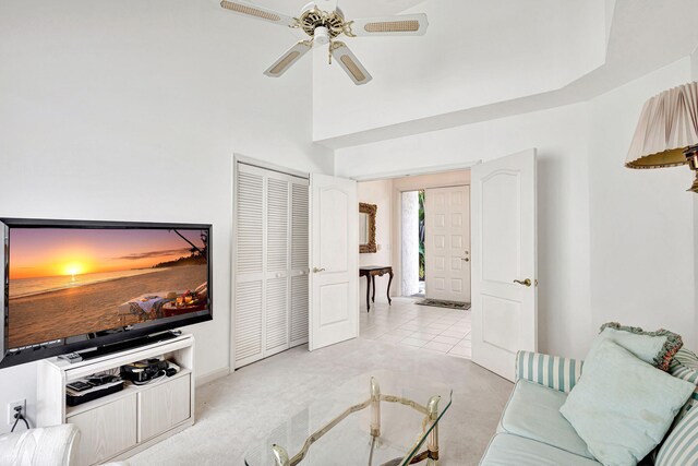 carpeted living room featuring ceiling fan