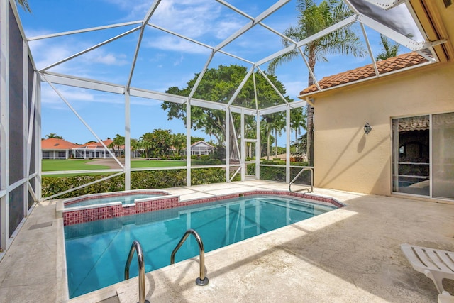 view of swimming pool with glass enclosure, a patio, and an in ground hot tub