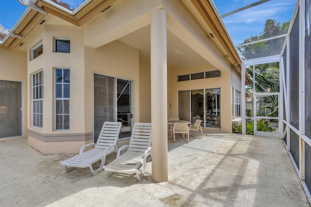 view of patio / terrace with glass enclosure