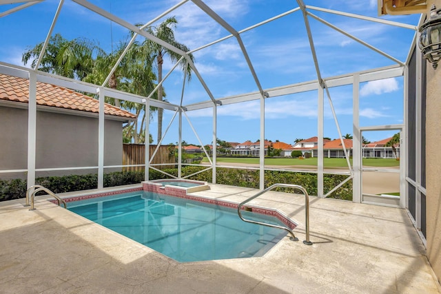 view of pool with an in ground hot tub, a patio area, and a lanai