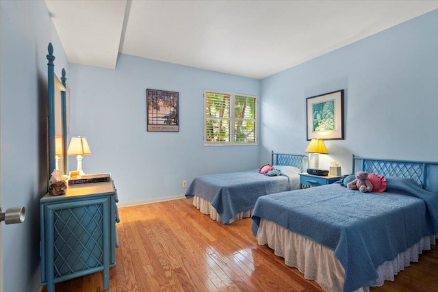 bedroom with hardwood / wood-style floors