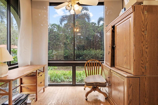 sunroom / solarium with ceiling fan