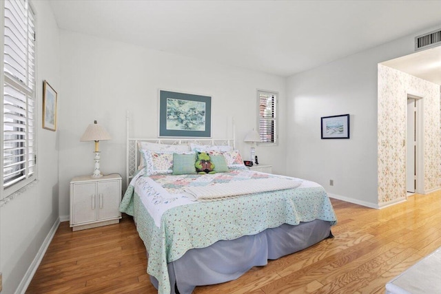 bedroom featuring wood-type flooring