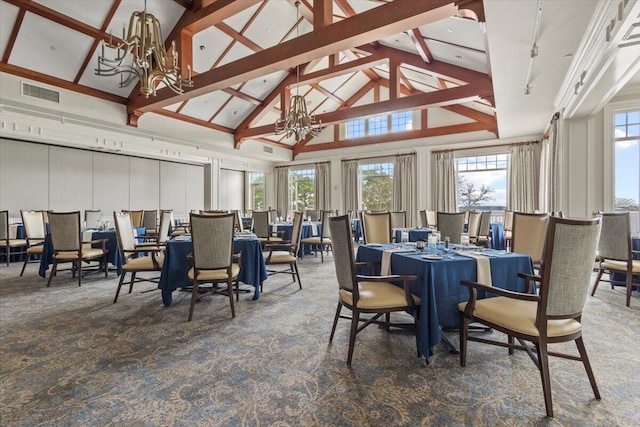 dining space featuring dark carpet and a chandelier