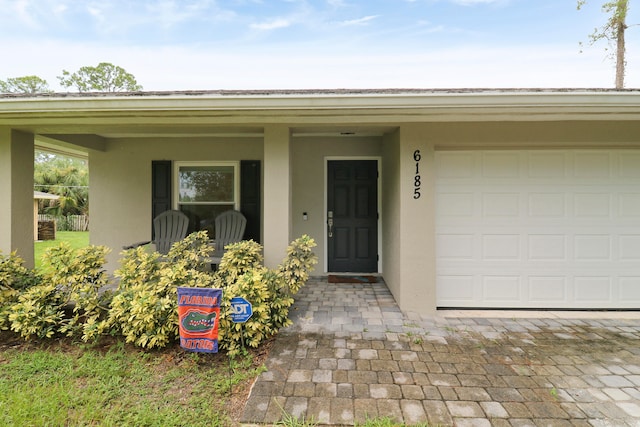 property entrance with a garage