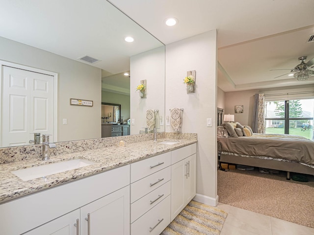 bathroom featuring double vanity, tile patterned flooring, and ceiling fan