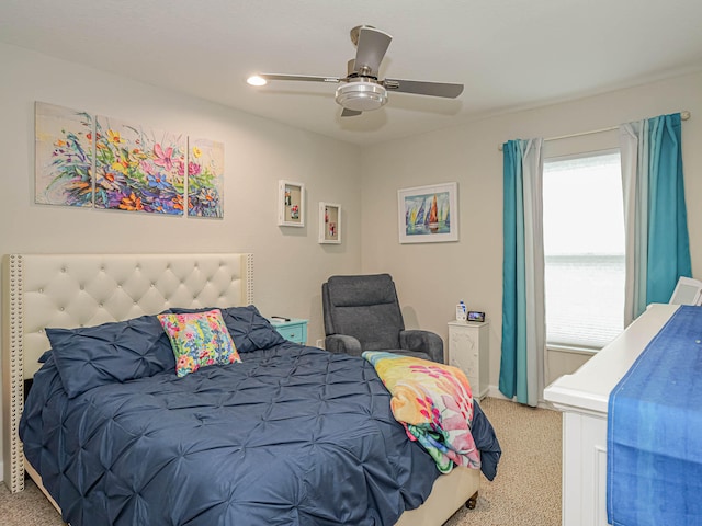 carpeted bedroom with ceiling fan