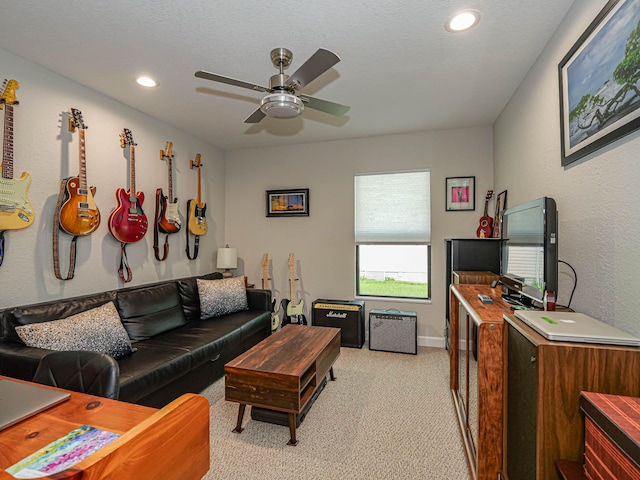 living room featuring light carpet and ceiling fan