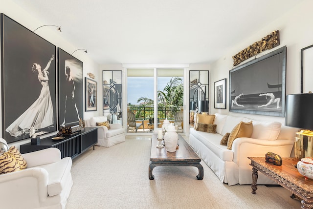 living room with carpet flooring and floor to ceiling windows