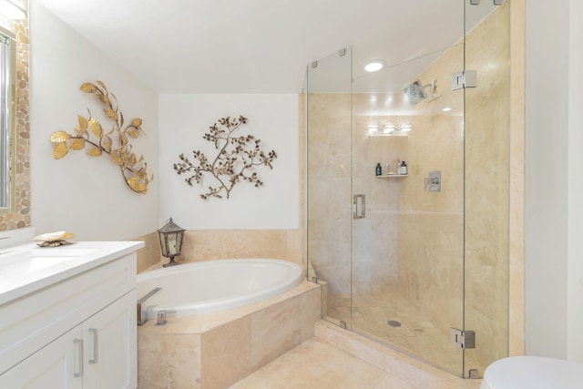 bathroom featuring tile patterned floors, vanity, and plus walk in shower