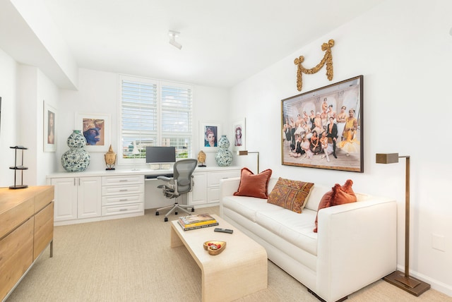 office with light colored carpet and built in desk