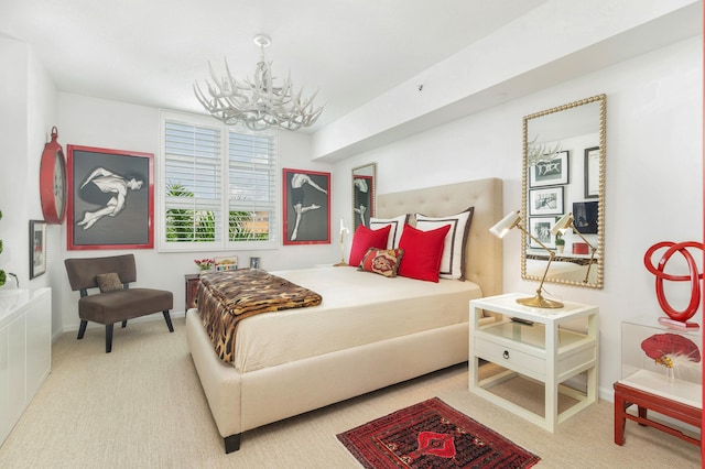 carpeted bedroom featuring a chandelier