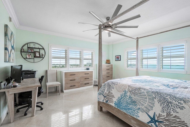 bedroom featuring ceiling fan, ornamental molding, and a textured ceiling