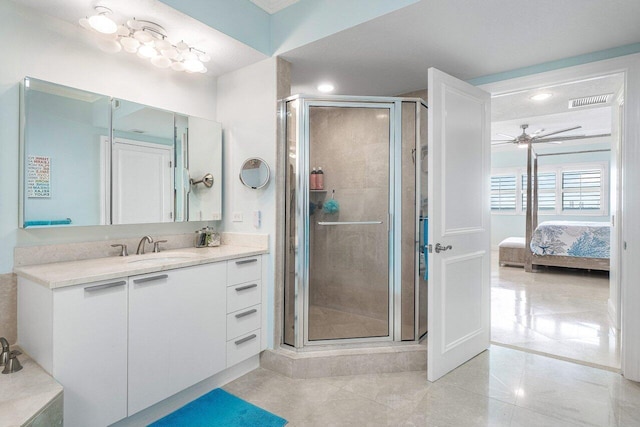 bathroom featuring ceiling fan, tile patterned floors, vanity, and an enclosed shower