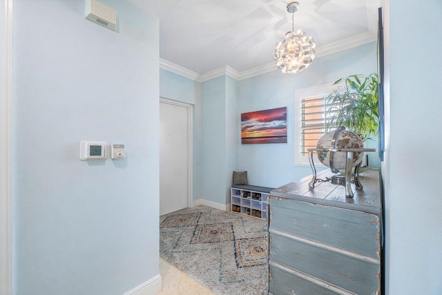 interior space with ornamental molding and a chandelier