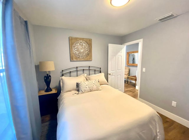 bedroom featuring hardwood / wood-style floors