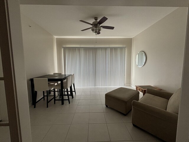 tiled living room with ceiling fan