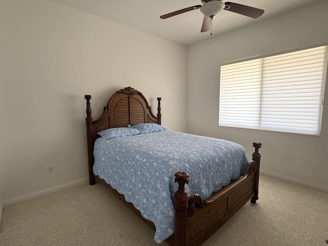 bedroom with carpet floors, ceiling fan, and baseboards