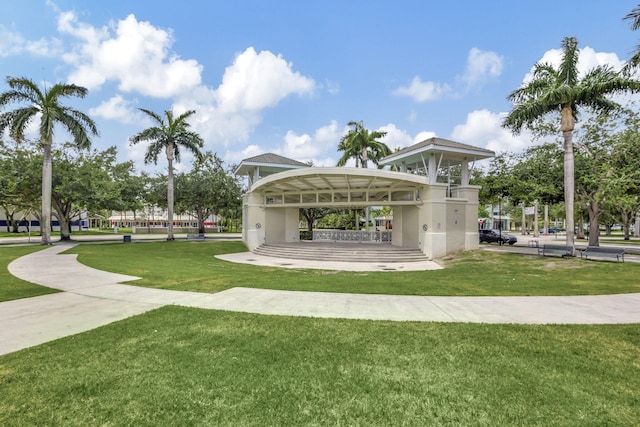 surrounding community with a gazebo and a yard