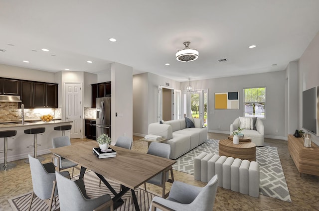 dining space with recessed lighting, visible vents, and baseboards