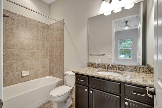 full bath featuring shower / bathtub combination, ceiling fan, vanity, and toilet