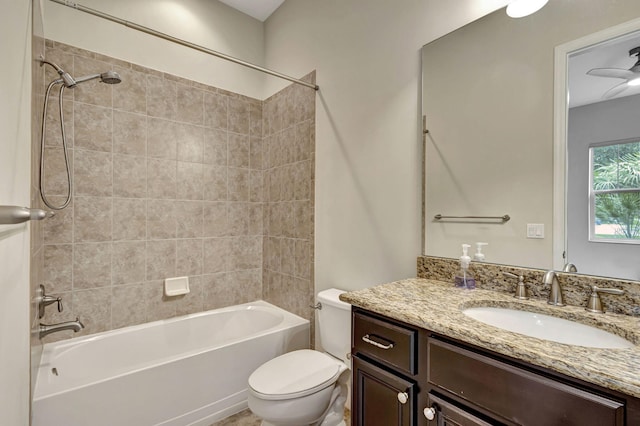 full bathroom featuring vanity, toilet, and tiled shower / bath