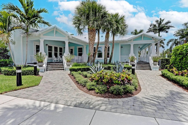 2710 W Mallory Blvd, Jupiter, FL 33458 - view of front of house with a porch and stairs