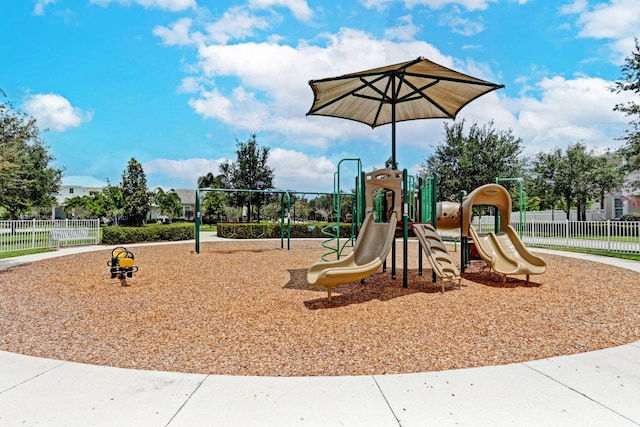 communal playground featuring fence