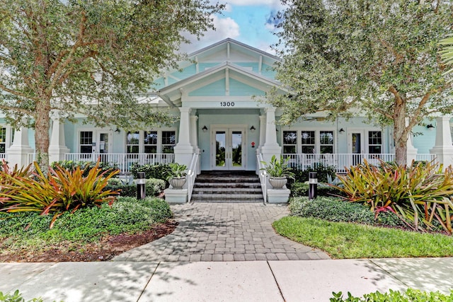 view of front of home featuring a porch and french doors