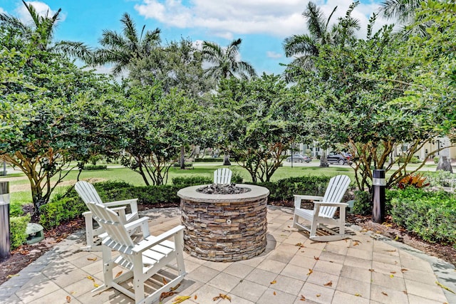 view of patio / terrace with an outdoor fire pit