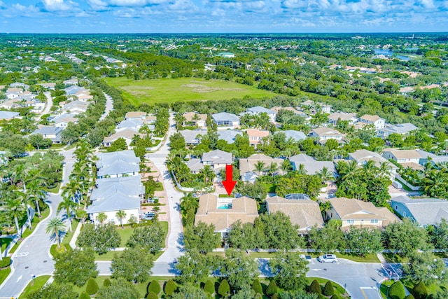 birds eye view of property with a residential view