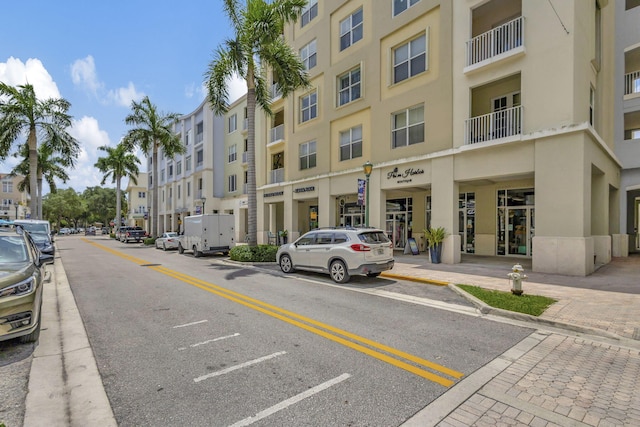 2710 W Mallory Blvd, Jupiter, FL 33458 - view of asphalt street featuring sidewalks, curbs, and street lights