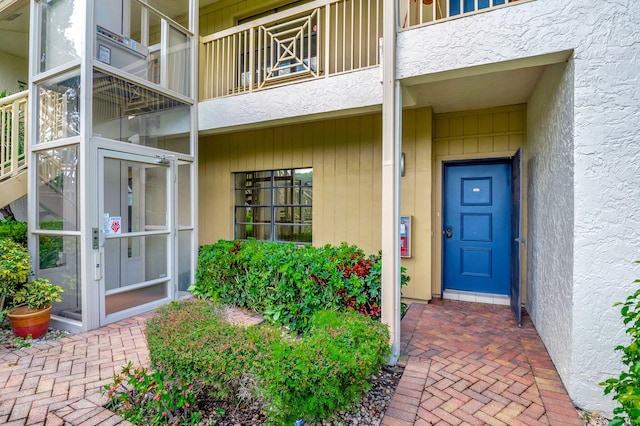 entrance to property with a balcony