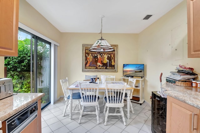 dining space with wine cooler and light tile patterned floors