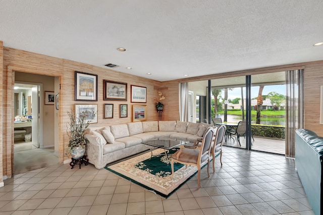 tiled living room with a textured ceiling