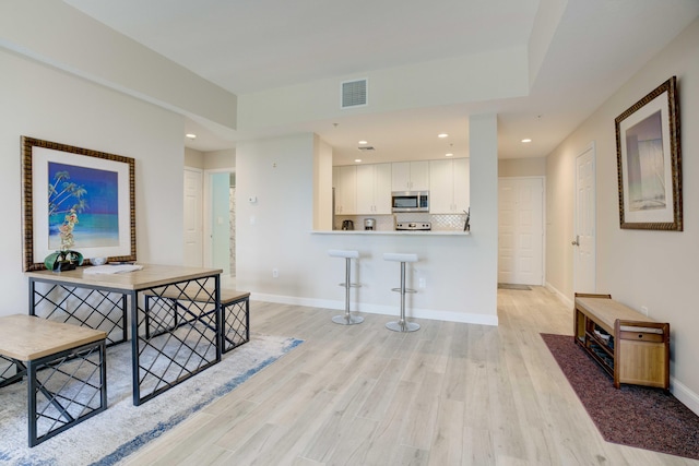 hall featuring light hardwood / wood-style flooring