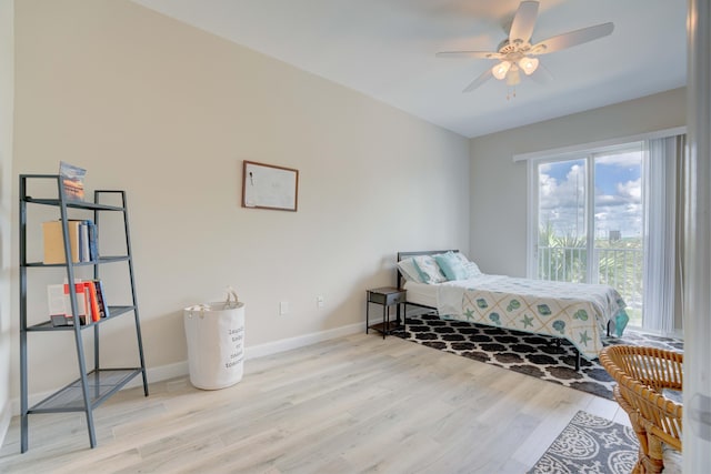 1203 Town Center Dr Unit 313, Jupiter, FL 33458 - bedroom with baseboards, ceiling fan, and wood finished floors