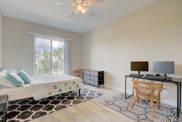1203 Town Center Dr Unit 313, Jupiter, FL 33458 - bedroom with a ceiling fan, baseboards, vaulted ceiling, and wood finished floors