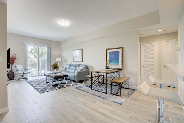 1203 Town Center Dr Unit 313, Jupiter, FL 33458 - living area with baseboards and wood finished floors